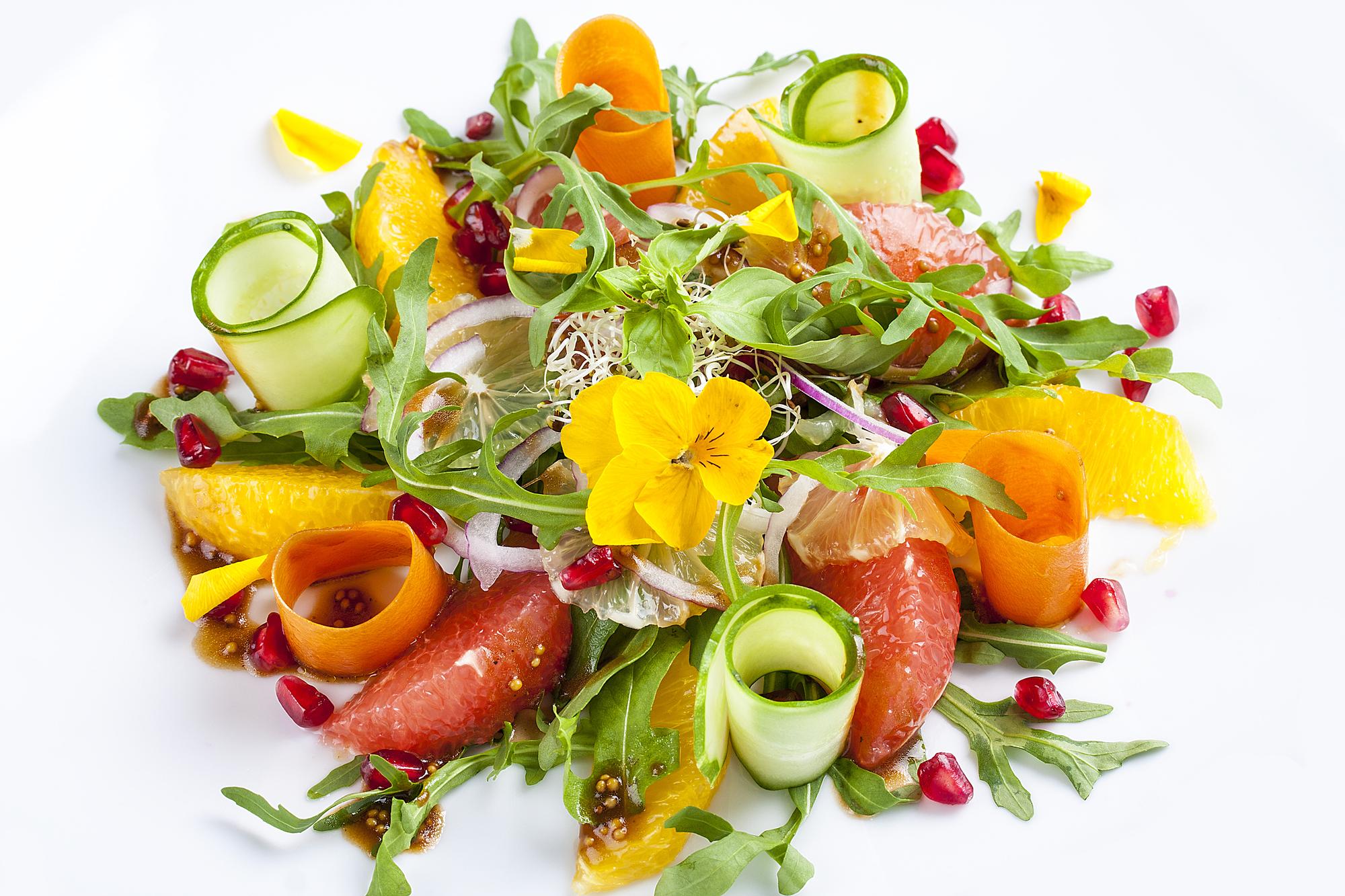 Plated seasonal salad with edible flowers